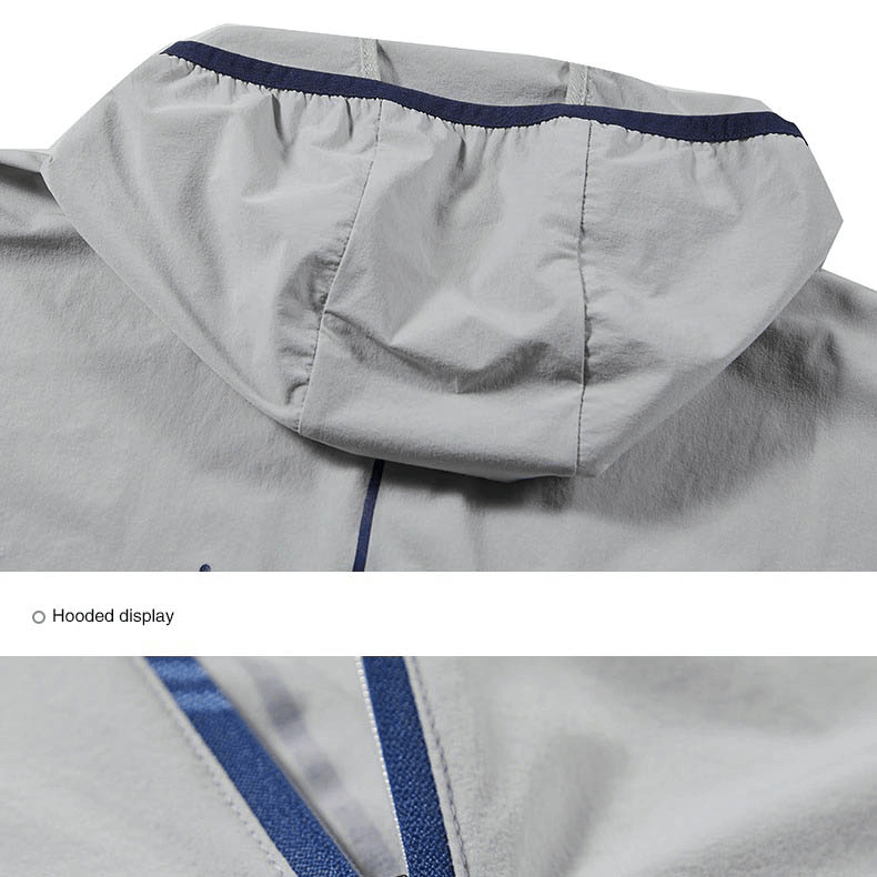 Close-up of gray windproof hooded hiking jacket for men, featuring durable and breathable fabric with a stylish design.
